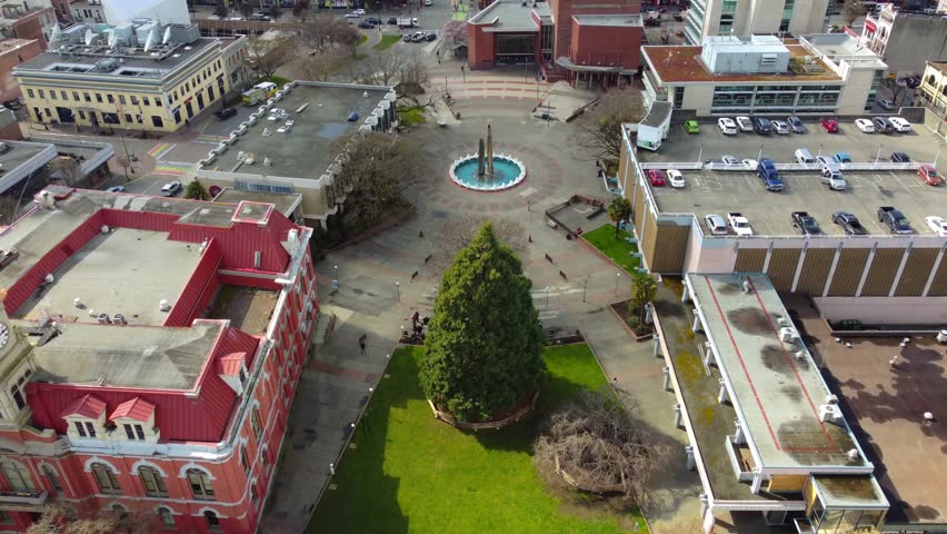 An aerial of the buildings under a blue sky with clouds in Victoria, British Columbia, Canada.