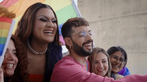Diverse group of happy young people taking funny selfie for social media celebrating gay pride festival day. Lgbt community concept cheerful friends outdoors. Generation z enjoy party. Vídeo Stock
