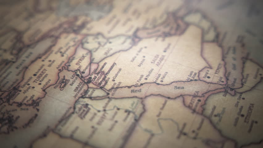 Middle East (Israel, Syria, Egypt, Jordan, Lebanon, Iraq, Saudi Arabia) on a vintage political world map. Slow motion, tracking arc shot.