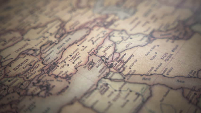 Turkey on a vintage political world map. Slow motion, tracking arc shot.