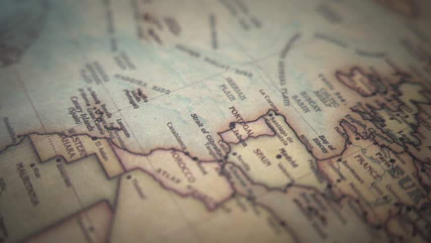 Spain and Portugal on a vintage political world map. Slow motion, tracking arc shot.