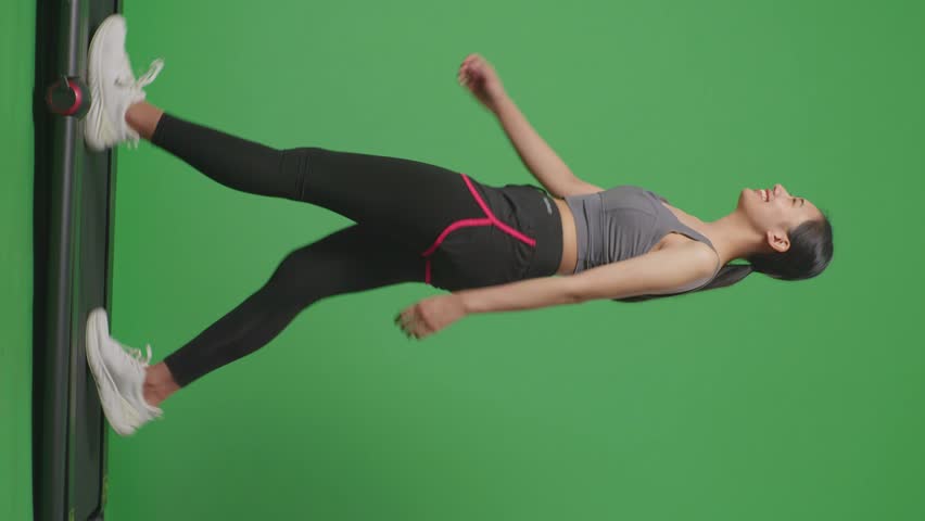 Full Body Of Side View Tired Asian Woman Wearing Sportswear And Walking On Treadmill On Green Screen Background In The Studio
 Royalty-Free Stock Footage #1103343111
