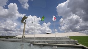 4K wide angle video with Juscelino Kubitschek President Memorial landmark museum in Brasilia, Brazil, during a sunny day with blue sky.