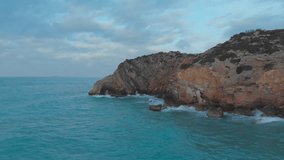 Drone captures Majestic Cliffs Bathed in Golden Morning Light