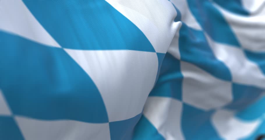Bavaria civil flag waving in the wind. Blue and white lozenges pattern. State in the south-east of Germany. Seamless 3d render animation. Slow motion loop. Selective focus. Fluttering fabric. Close-up