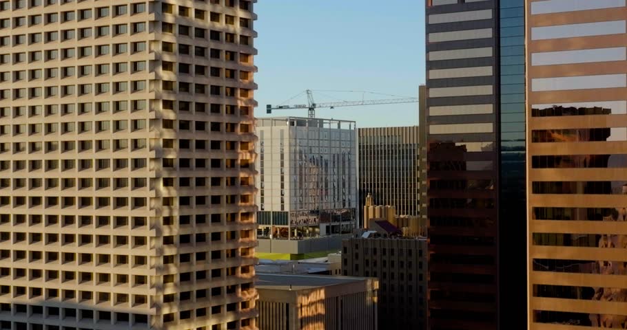 Drone shot in middle of buildings in downtown Phoenix, in sunny Arizona, USA