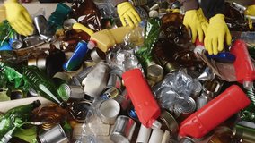 Workers Materials Recovery Facility sort recyclable waste into paper plastics metal glass and other types of material. Manual sorting separated domestic waste - Powered by Shutterstock - Get 15% off with code: PIKWIZARD15