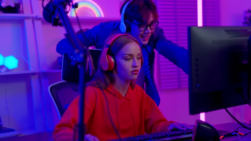 Portrait of young asian games women play computer pc. Teams lost, regretting the chance of win in tournament. Streaming game online at home. Lose and game over concept.