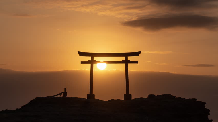 Sunrise over a Tori Gate by the sea: Japanese new year concept (Timelapse | Zoom Out) Royalty-Free Stock Footage #1103362409