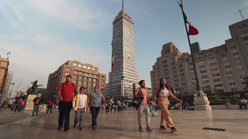 MEXICO CITY, MEXICO - JANUARY 11, 2023: The Torre Latinoamericana, is a skyscraper in downtown Mexico City, situated in the historic city center. Slow motion steadicam footage.
