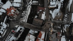 Aerial video of a snowy town in the Tyrol region of Italy during sunset