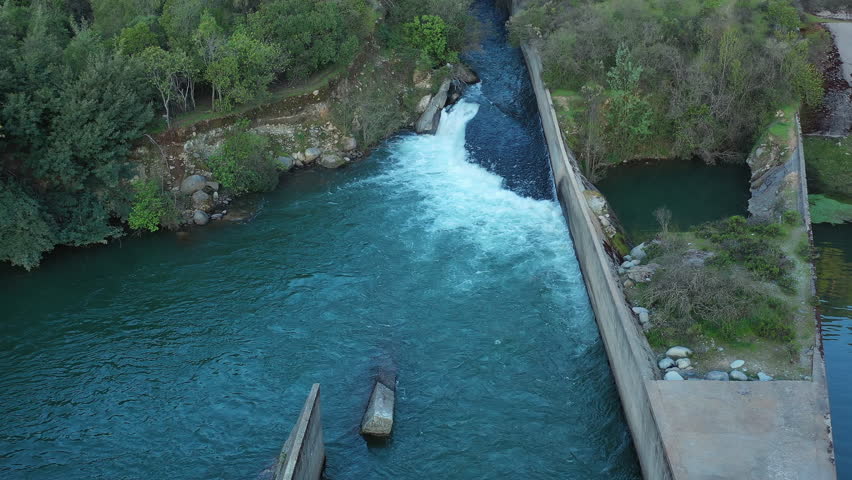 Streams of water between mountain stones, Maule river, Chile