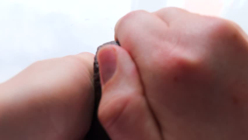 The girl cut the avocado and opens it. Avocado cut, close-up. selective focus