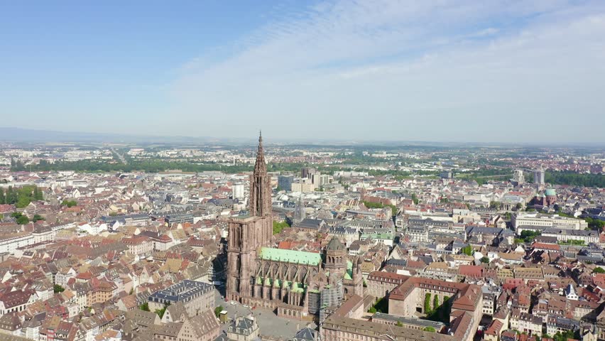Inscription on video. Strasbourg, France. The historical part of the city, Strasbourg Cathedral. Flames with dark fire, Aerial View, Point of interest