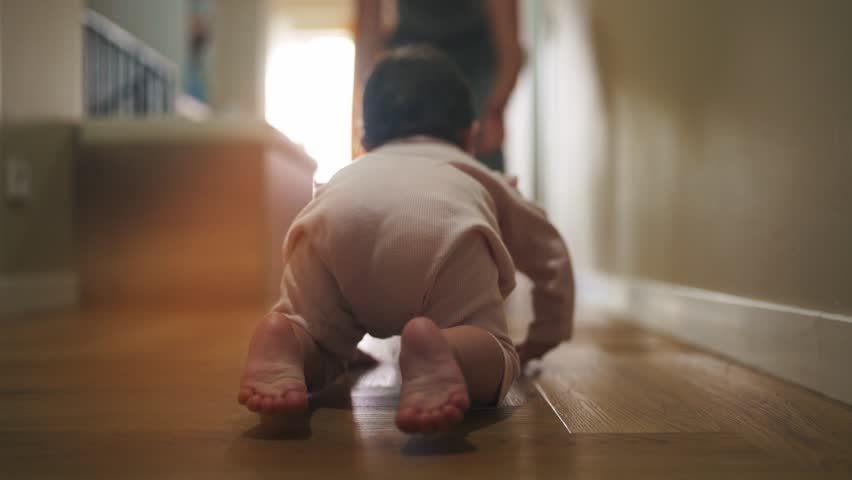 father teaches baby to crawl. happy family first steps kid dream concept. father helps baby newborn crawling on the floor in house. baby girl crawling on the floor lifestyle takes her first steps Royalty-Free Stock Footage #1103379763