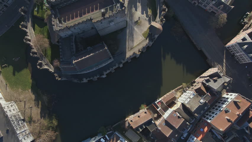 Top down fly over of Gravensteen Castle and canal in Ghent Belgium
