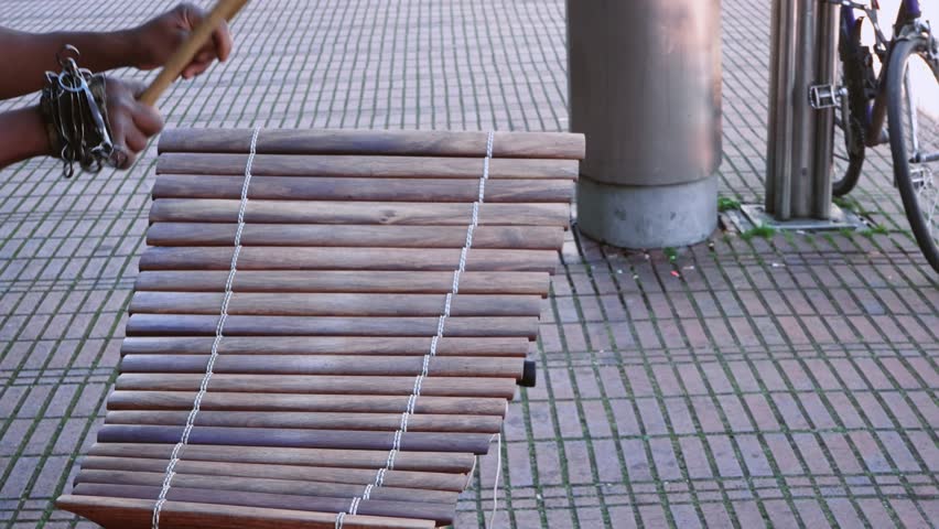Street performer hands of musician playing the vibraphone xylophone in Cologne, Germany, slow motion