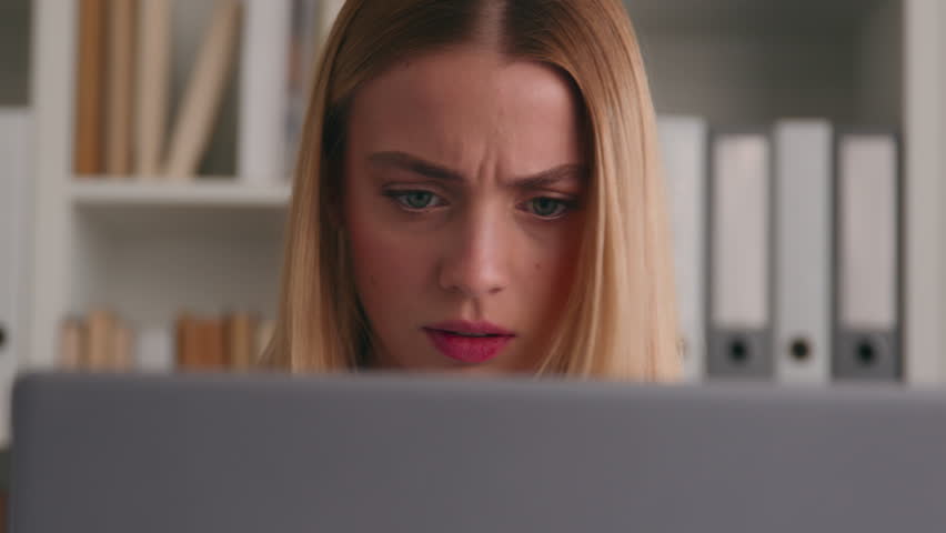 Frowning confused puzzled shocked Caucasian woman looking negative shock to laptop bad result failure business problem online home office frustrated student girl in library computer trouble stressed Royalty-Free Stock Footage #1103391071