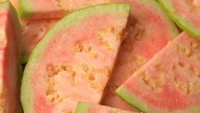 Rotational 360 degree video of guava fruit. Pink guava closeup video.