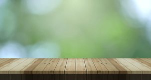 Top table wooden old texture on green bokeh blurred background Top wooden table space area for product display High quality footage 4K ProRes422