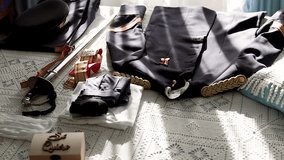 Military uniform with a sword prepared on a camera for a wedding. Detail plan. - Powered by Shutterstock - Get 15% off with code: PIKWIZARD15