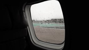 Airliner takes off on the runway during the rain. A passenger plane starts to take off and takes off at the airport on a rainy day. Travel in any weather.