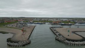 This aerial drone video shows the harbour of Oudeschild, Texel. There are a few old fisherships which now are being used as tourist boats. 