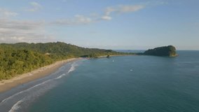 This aerial drone video shows the beach and coastline at Manuel Antonio, Costa Rica. This beautiful beach at the pacific ocean can be found in the province Puntarenas. 