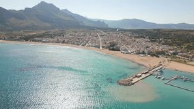 This aerial drone video shows the beauty of Sicily. This small town named San Vito Lo Capo is located at the beautiful coastline of the mediterranean sea. This beach is very touristic. 