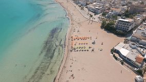 This aerial drone video shows the beauty of Sicily. This small town named San Vito Lo Capo is located at the beautiful coastline of the mediterranean sea. This beach is very touristic. 
