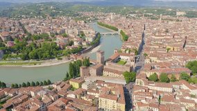Inscription on video. Verona, Italy. Flying over the historic city center. Castelvecchio Castello Scaligero, summer. Flames with dark fire, Aerial View, Point of interest