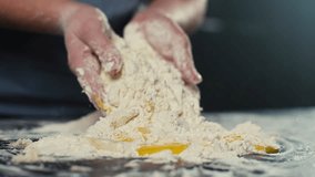 Mixing flour and eggs for making dough close-up. Female hands make homemade pastries and bread in the kitchen. High quality 4k footage - Powered by Shutterstock - Get 15% off with code: PIKWIZARD15