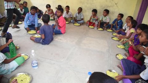 MAHARASHTRA, INDIA July 10, 2015: rural school children having food, July 10, 2015, Salunkwadi, Ambajogai, Beed, Maharashtra, India
