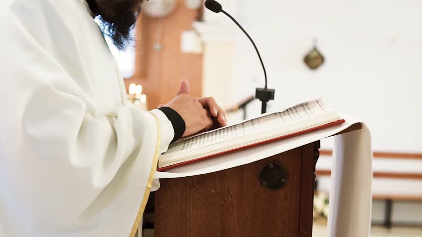 Preacher Explaining Holy Bible At Altar During Wedding Ceremony 