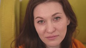 brunette woman crying. tears run down her face. close-up face. slow motion video. High quality Full HD video recording