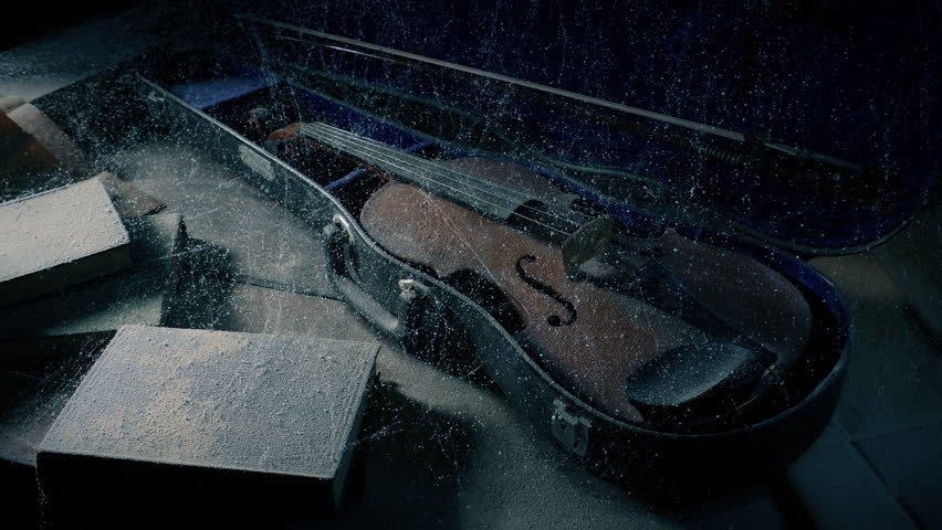 Man Picks Up An Old Violin From Dusty Table Royalty-Free Stock Footage #1103436267