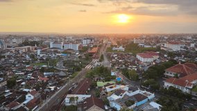 Urban in Yogyakarta, Indonesia with sunset view in the evening. There is also the Tugu Jogja station which is the central train station in Yogyakarta.