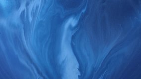Liquid paint mixing backdrop with splash and swirl. Fluid art drawing video. Acrylic texture with colorful waves. Detailed background motion with white, blue and golden colors.