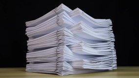 Decreased stack of paper documents with clip on wooden table. Corporate business financial data management concept. Organize Documents – 4K Stop Motion, Stack Files Overload 