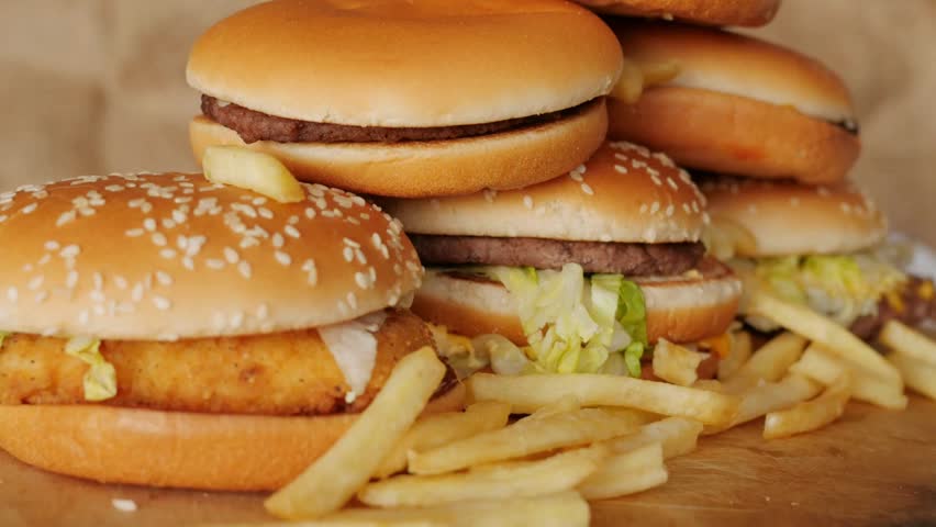 Stack of Burgers, Unhealthy Foods, Fast Foods, Fries, Foods, Rotating Burger, Slow motion Food. Royalty-Free Stock Footage #1103460611