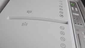 a Paper shredder is Shredding confidential or Classified documents  - Powered by Shutterstock - Get 15% off with code: PIKWIZARD15