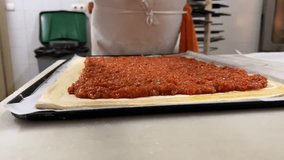 Bakery scene: elaboration of a traditional handmade tomato empanada (turnover). - Powered by Shutterstock - Get 15% off with code: PIKWIZARD15