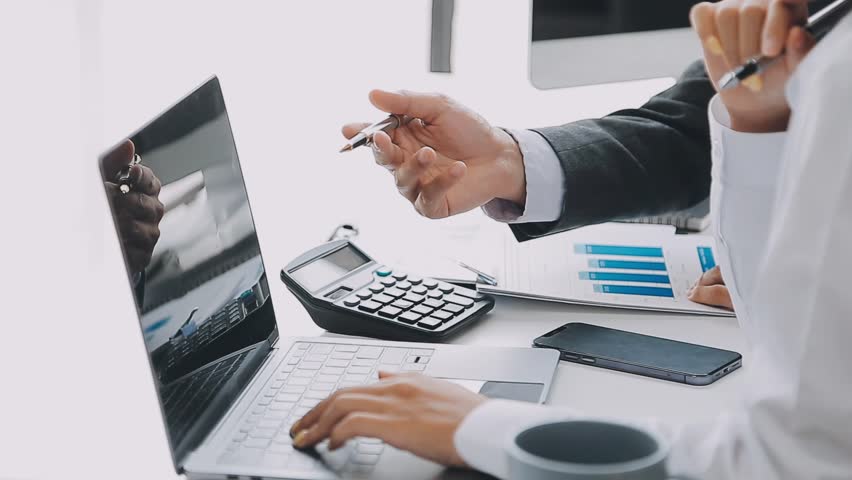 Businesswoman or accountant working Financial investment on calculator, calculate, analyze business and marketing growth on financial document data graph, Accounting, Economic, commercial concept. Royalty-Free Stock Footage #1103464353