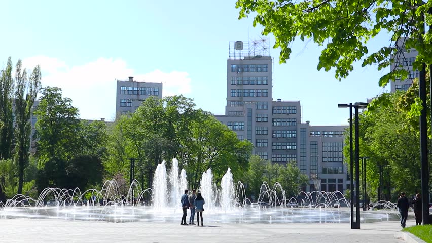 Derzhprom building with fountain and green park in spring on Freedom Square in Kharkiv city center. Travel destinations in Ukraine Royalty-Free Stock Footage #1103466383