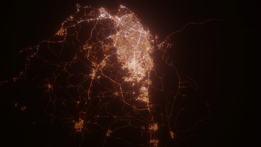 Barranquilla (Colombia) aerial view at night. Satellite view on modern city with street lights. Camera is flying above the city, moving forward