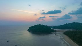 aerial hyperlapse view colorful sky of sunset above Kala island at Layan beach Phuket.
video 4K. Nature video High quality footage. 
Scene of Colorful romantic sky in sunset with cloud in the sky back