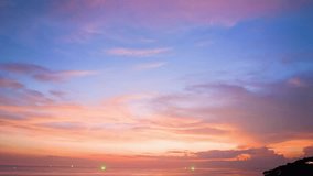 aerial hyperlapse view Beautiful sky above the sea in colorful sunset at Karon beach Phuket. 
Imagine a fantasy bright yellow sky at sunset. 
Gradient color. Sky texture, abstract nature background.