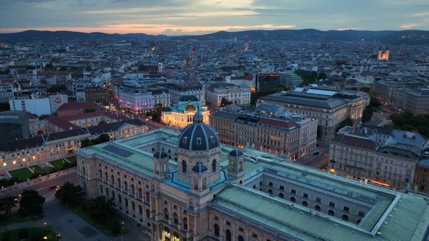 Vienna night aerial view, capital of Austria with evening lights, night life of Vienna in Austria, night illumination of Vienna opera house. High quality 4k footage