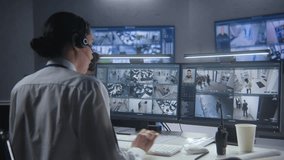 Female security officer watches security cameras with AI facial recognition with male colleagues. Monitoring center workers. Computer monitors and big digital screens with CCTV cameras video footage. - Powered by Shutterstock - Get 15% off with code: PIKWIZARD15