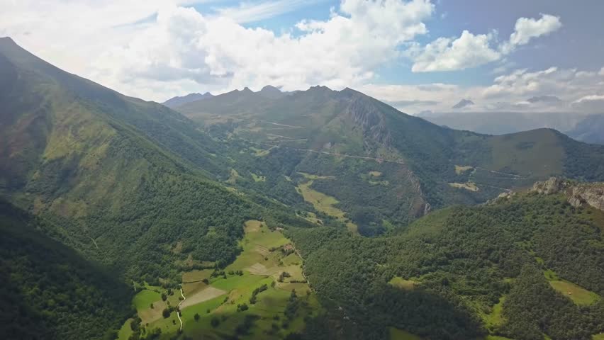 slowly gliding over the stunning hillsides of Picos de Europa, establishing, aerial views